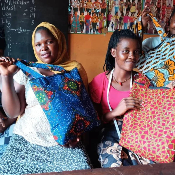 Colourful Tote Bag Changing Lives - tailors showing their designs-min