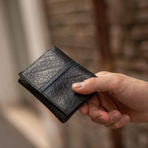 Trifold Recycled Wallet made from Inner Tubes - hand holding wallet